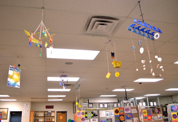 These mobiles each represent a different song using only shapes and colors.